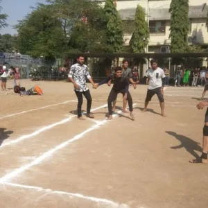 College students playing kho-kho on a marked dirt ground