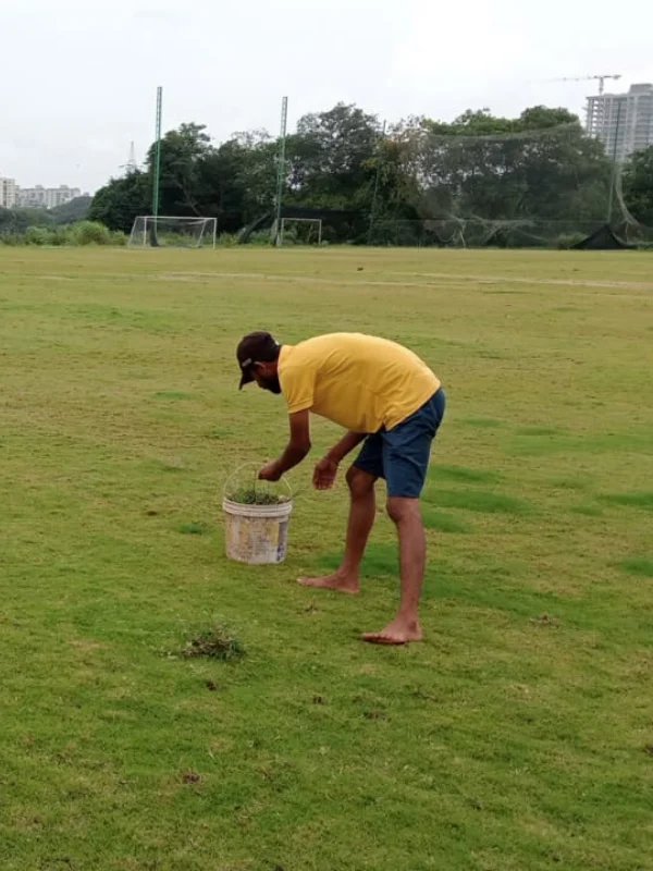 Ground cleaning service for sports field in Pune